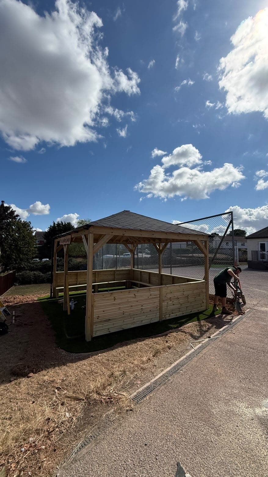 The Learning Lodge, a bespoke timber-framed outdoor shelter built by 4orty Construction, showing the exposed timber frame, joinery and shingled roof